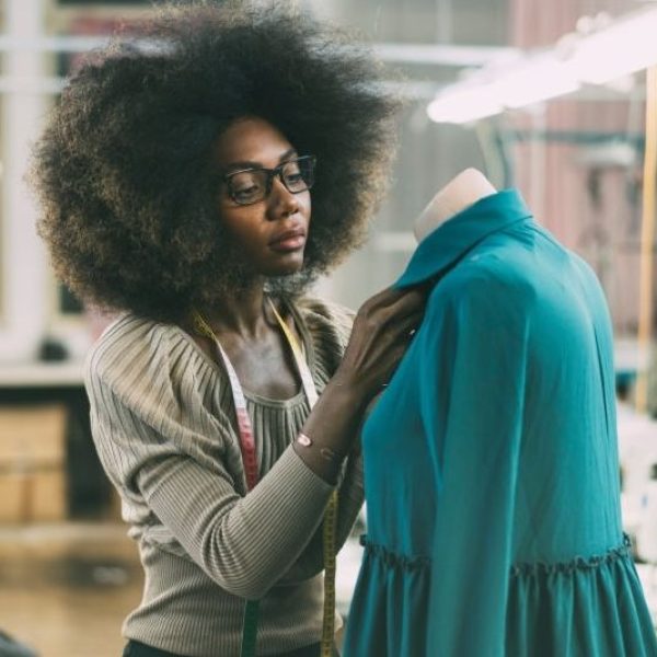 young fashion designer at her workplace image istock e1620476227602